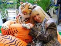 Kit Berry cuddles tiger